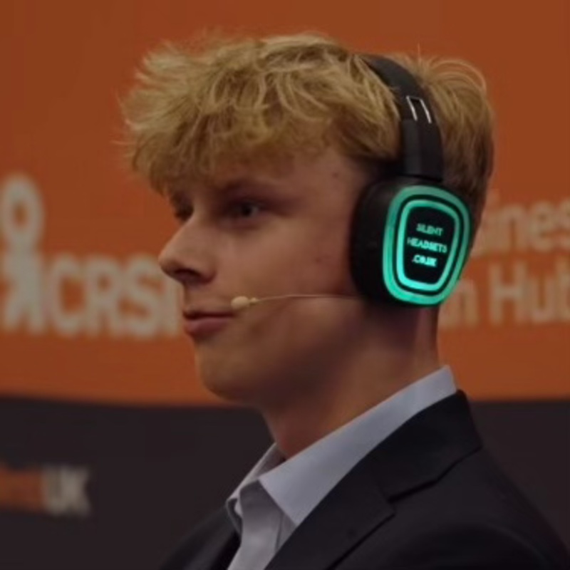Ethan Burniston speaking on a panel at Climb26